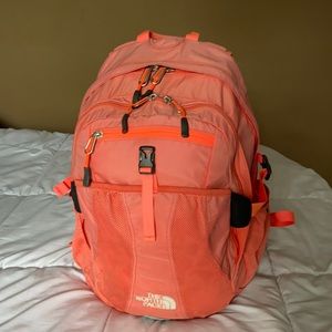 The North Face orange backpack